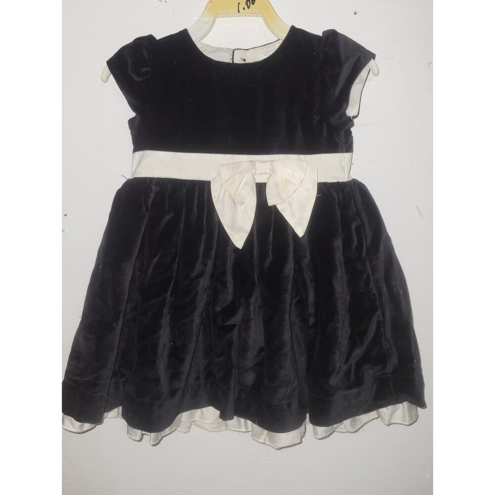 Black velvet dress with white bow